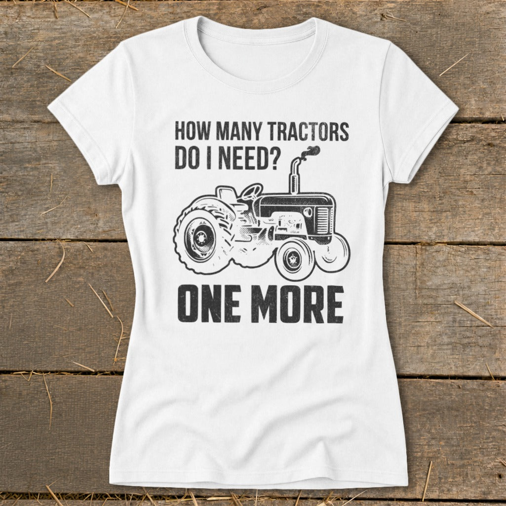 White t-shirt with distressed print: "How many tractors do I need? One more." and a tractor graphic.