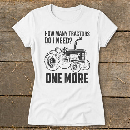 White t-shirt with distressed print: "How many tractors do I need? One more." and a tractor graphic.