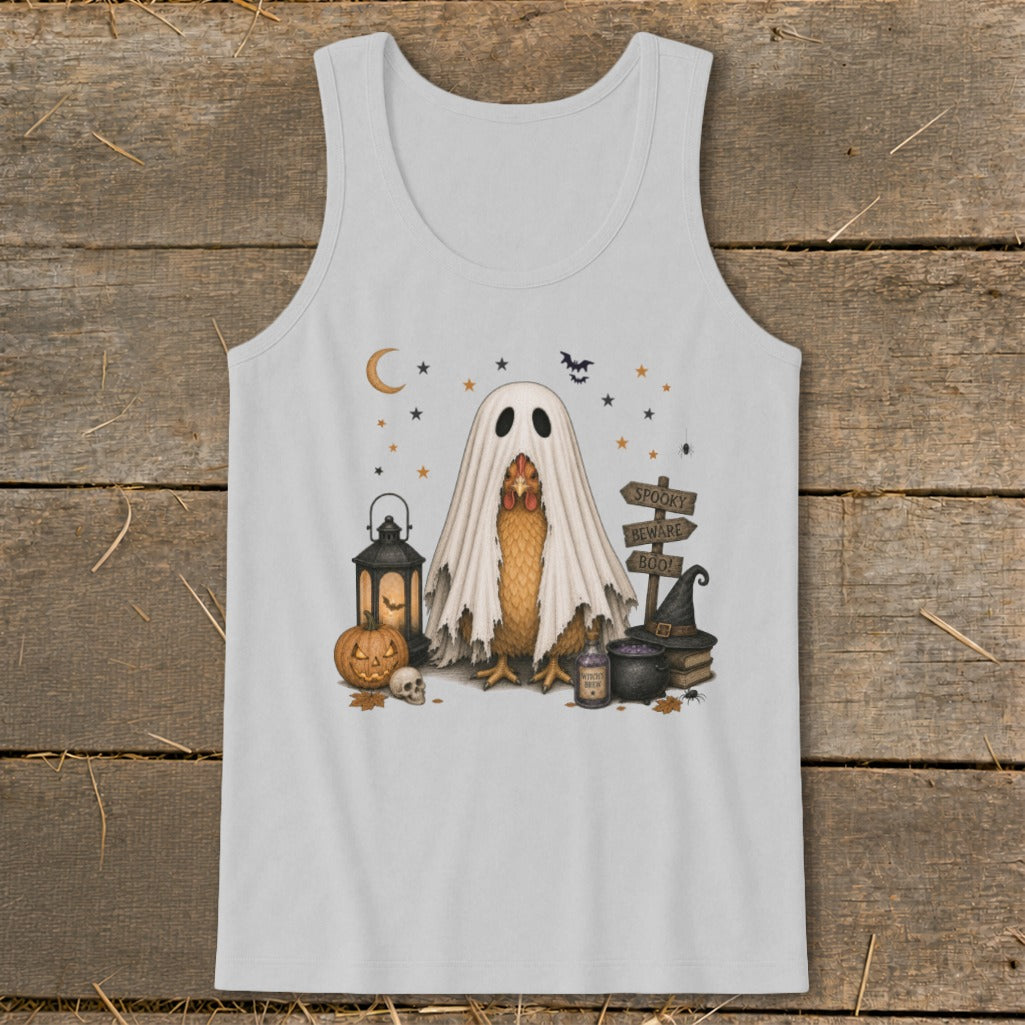 Chicken in ghost costume with Halloween decorations, including a pumpkin and signs.