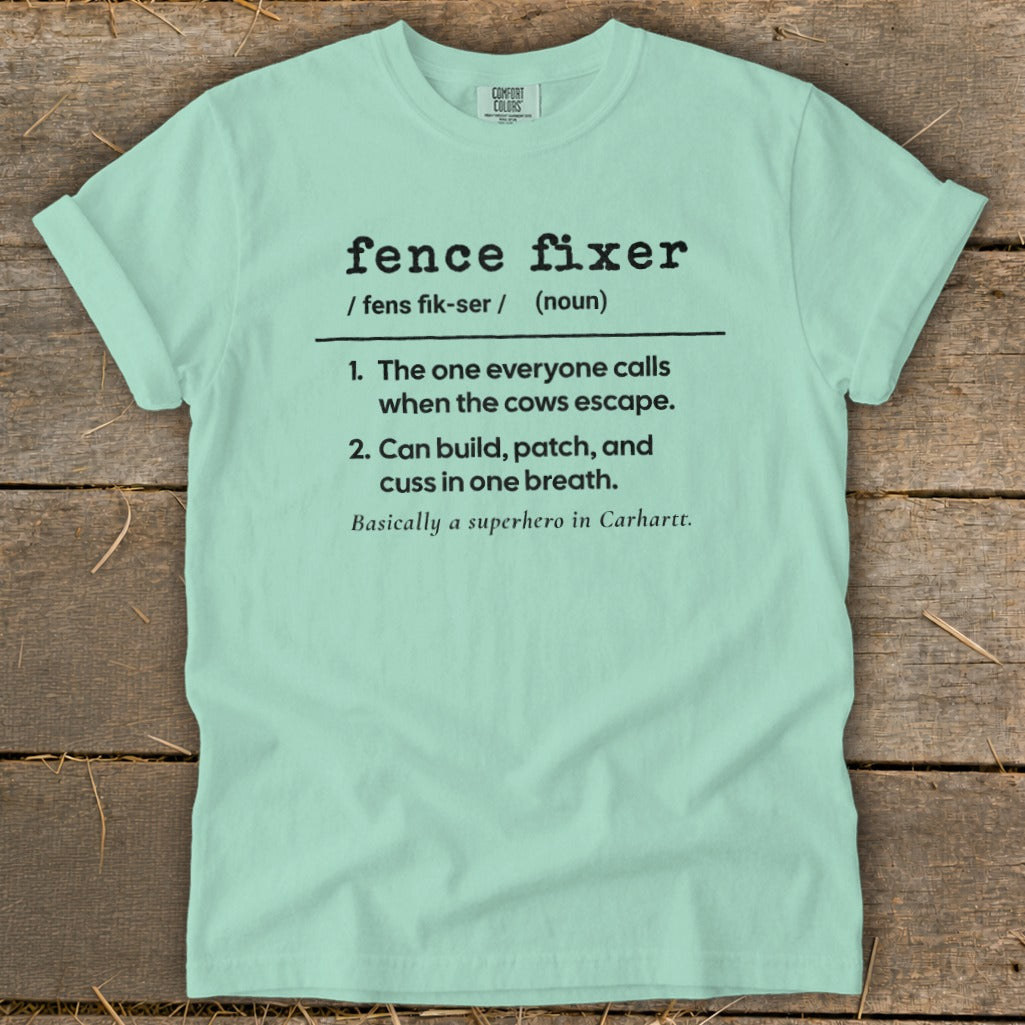 Light mint t-shirt with black text defining "fence fixer" as a superhero.