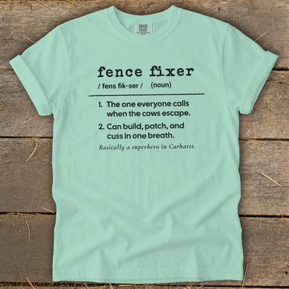 Light mint t-shirt with black text defining "fence fixer" as a superhero.
