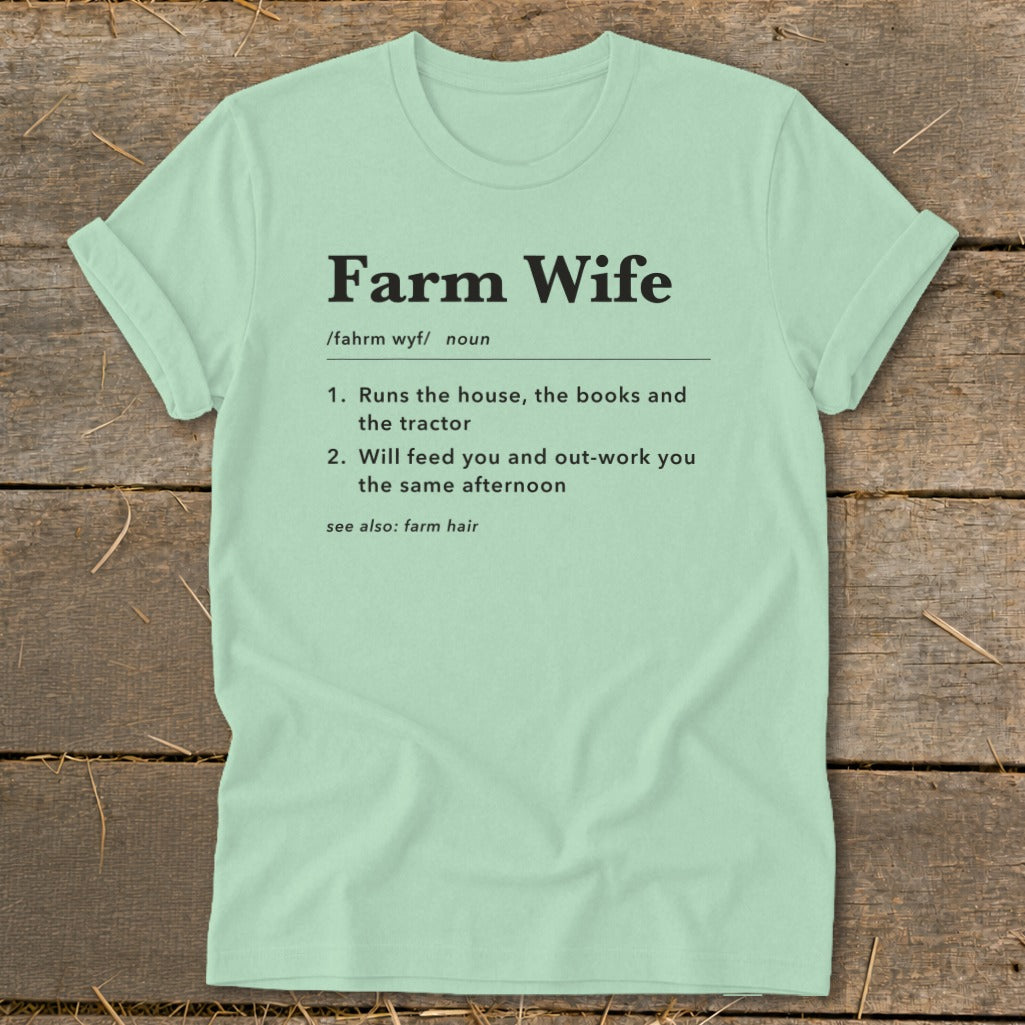 Light green t-shirt with "Farm Wife" definition including humor about running the house and tractor.