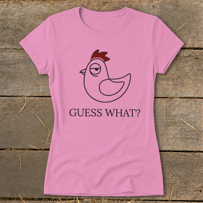 Pink t-shirt with a cartoon chicken and "Guess What?" text.