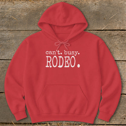 Red hoodie with "can't. busy. RODEO." graphic print on chest.