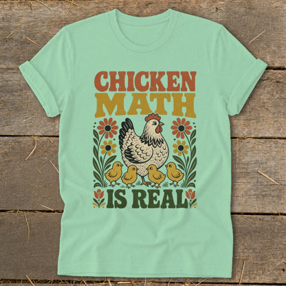 Chicken Math Is Real text with hen and chicks graphic on a mint t-shirt.