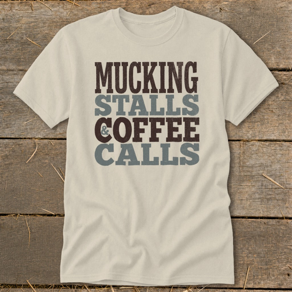 Cream t-shirt with "Mucking Stalls & Coffee Calls" printed in brown and gray.