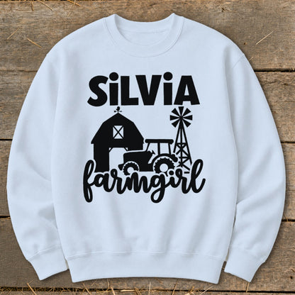 White sweatshirt with "Silvia farmgirl" text and farm graphics.
