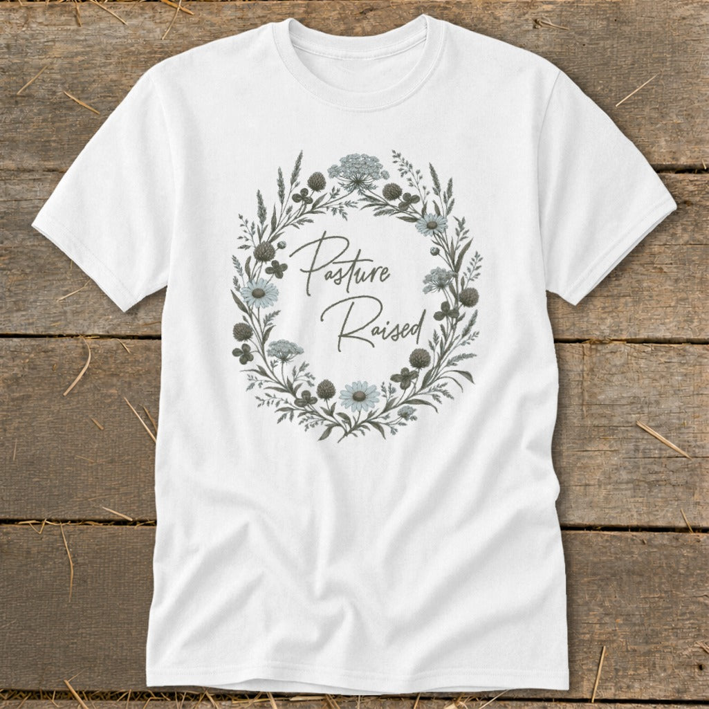 White t-shirt with floral wreath graphic saying "Pasture Raised".