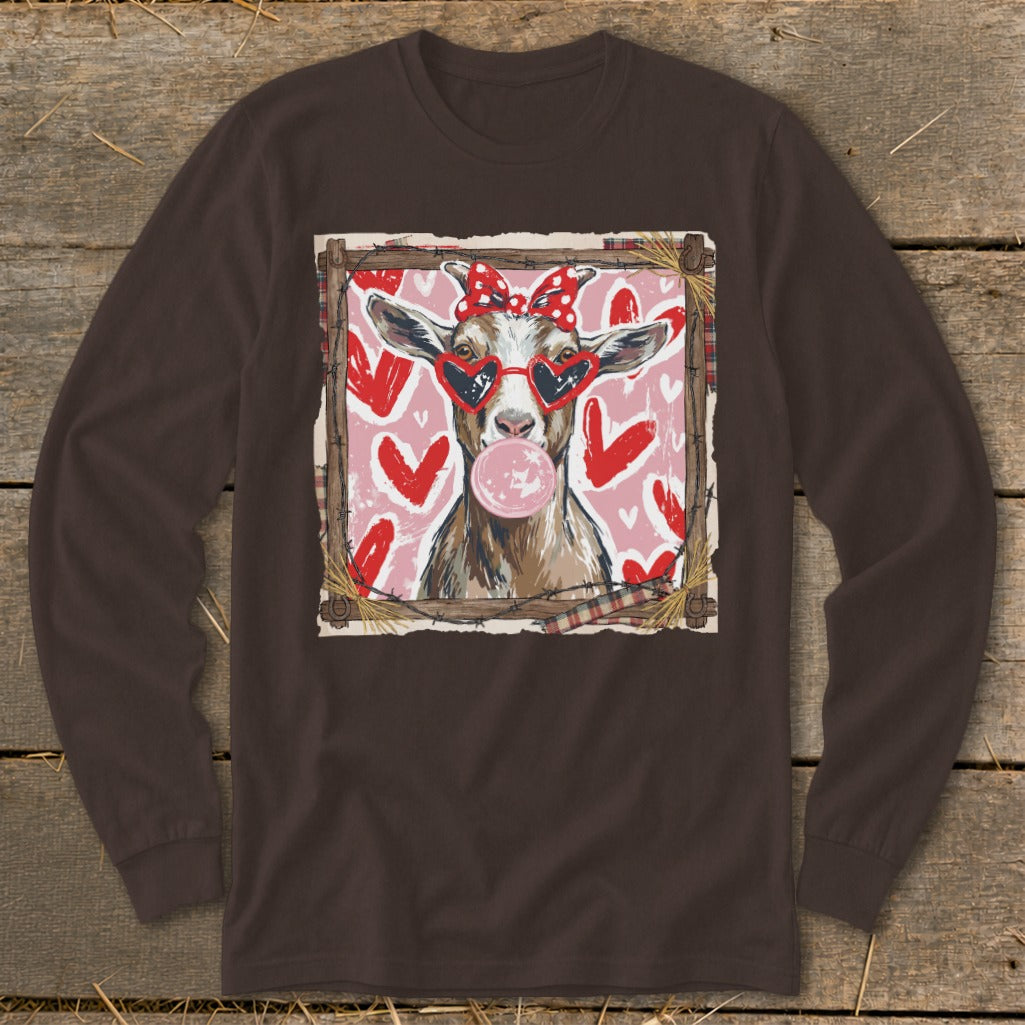Goat wearing heart sunglasses and bow blowing bubblegum against a pink heart background.