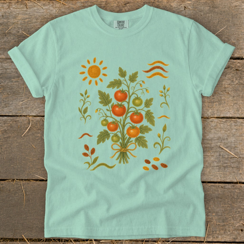 Mint t-shirt with a graphic of a tomato plant, sun, and leaves.