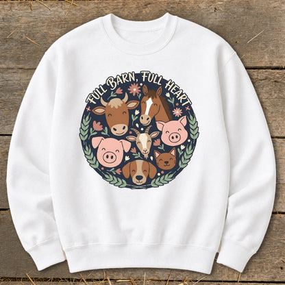White sweatshirt featuring a circular design of farm animals with text "FULL BARN, FULL HEART".