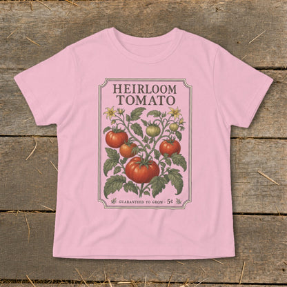 Pink t-shirt with "Heirloom Tomato" text and vintage tomato plant illustration.