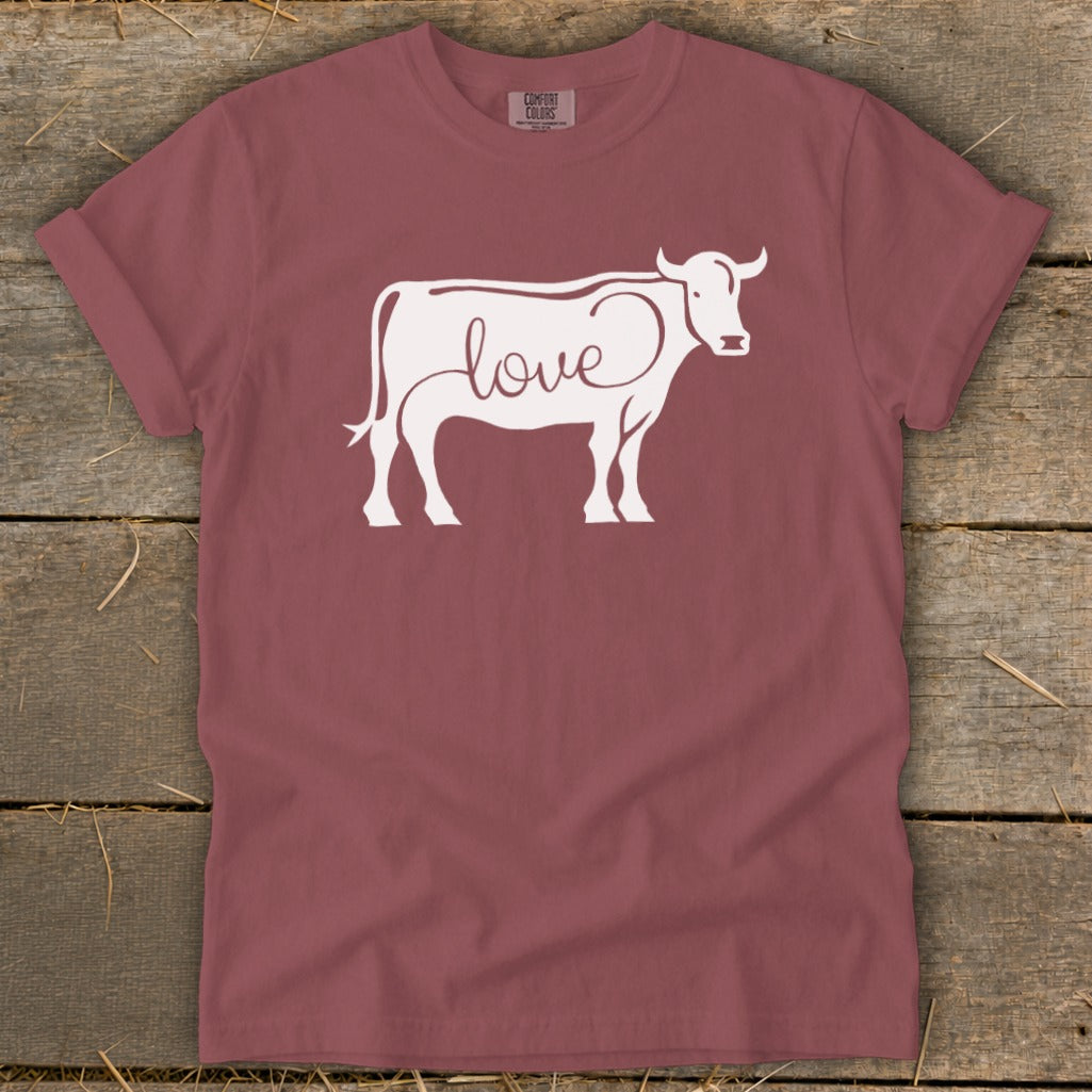 T-shirt with white cow graphic and the word "love" in cursive.