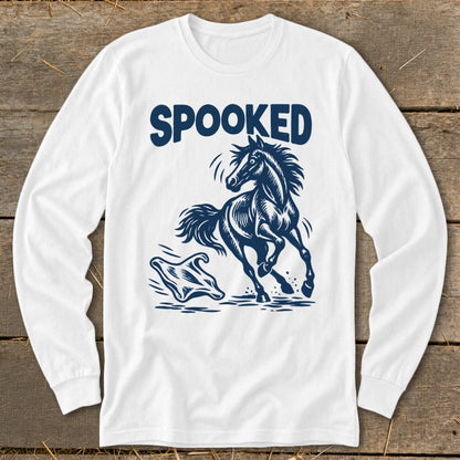 White long-sleeve shirt with blue "SPOOKED" text and a startled horse running from a ghost.