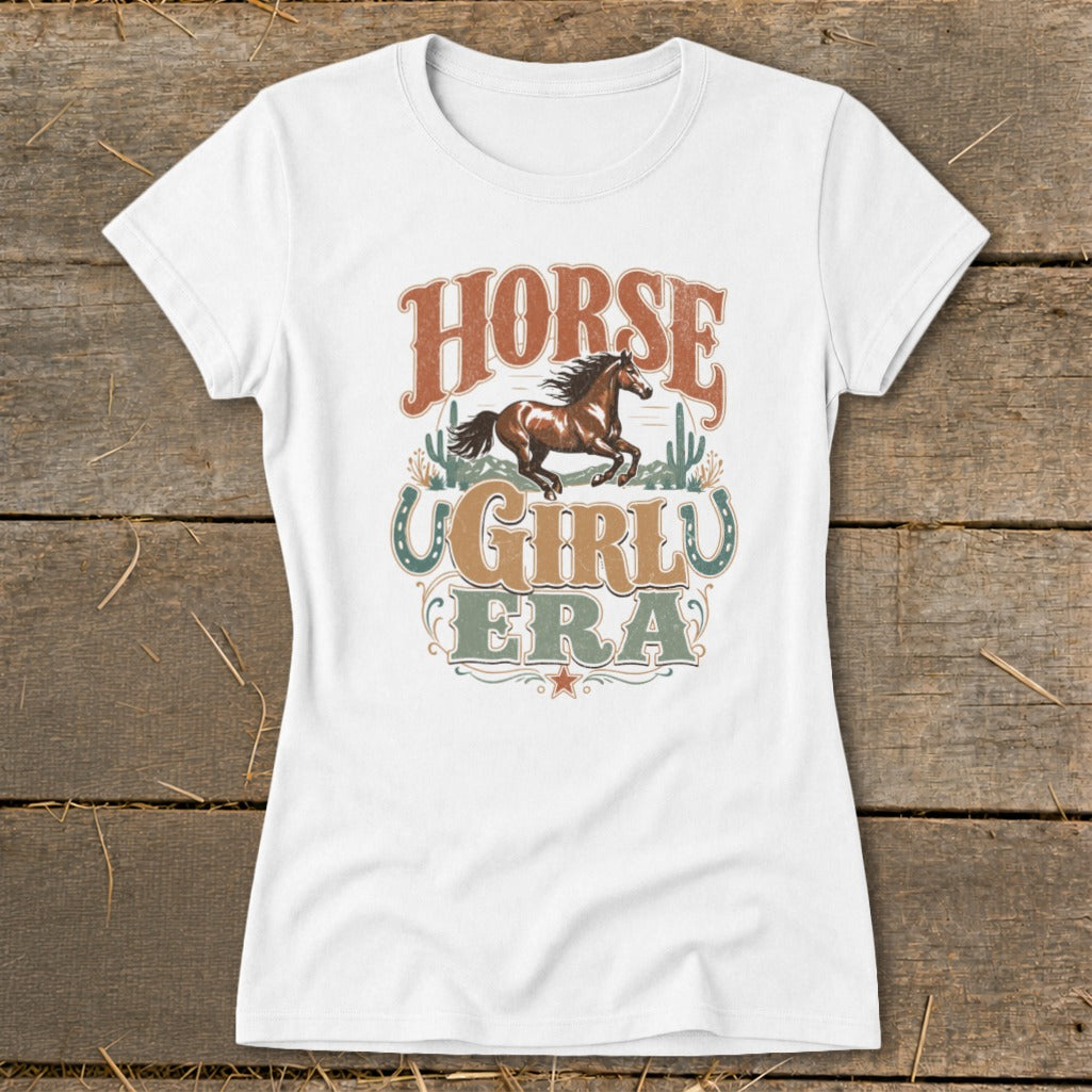 White t-shirt with "Horse Girly Era" text and running horse graphic.