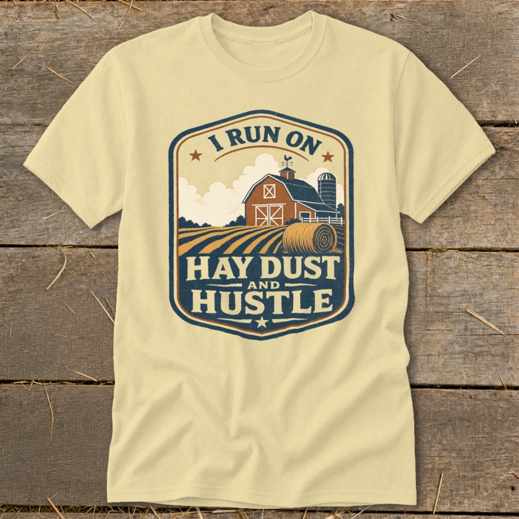 Yellow t-shirt with barn, hay bale, and "I RUN ON HAY DUST AND HUSTLE" text.