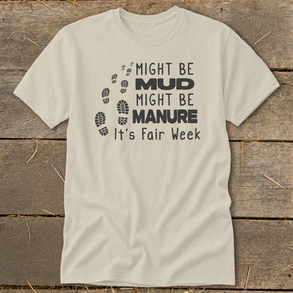 Cream t-shirt with "Might be Mud, Might be Manure, It's Fair Week" and footprints.