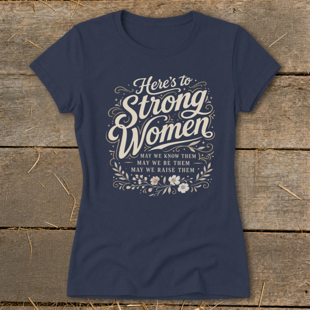 Navy t-shirt with "Here's to Strong Women" and "May we know them..." text.