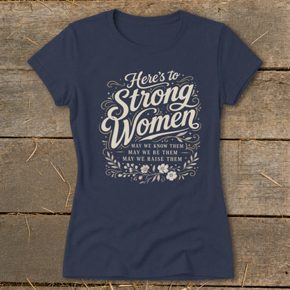 Navy t-shirt with "Here's to Strong Women" and "May we know them..." text.