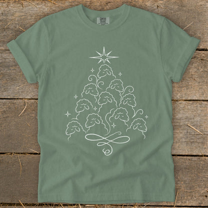 Green t-shirt with white outline of sheep forming a Christmas tree shape.