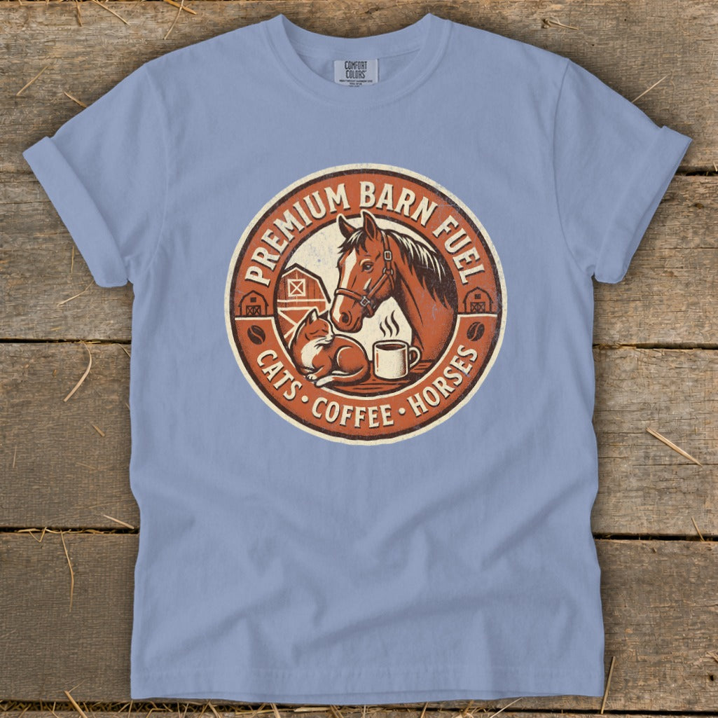 Light blue t-shirt with a circular graphic of a horse, cat, and coffee cup.