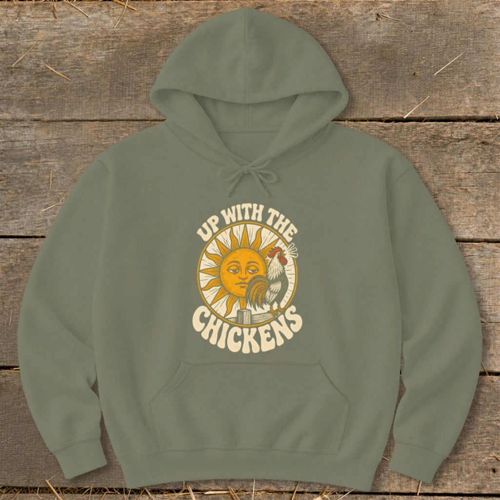 An olive green hoodie featuring a vintage-style graphic of a rooster and sun with text that reads up with the chickens.