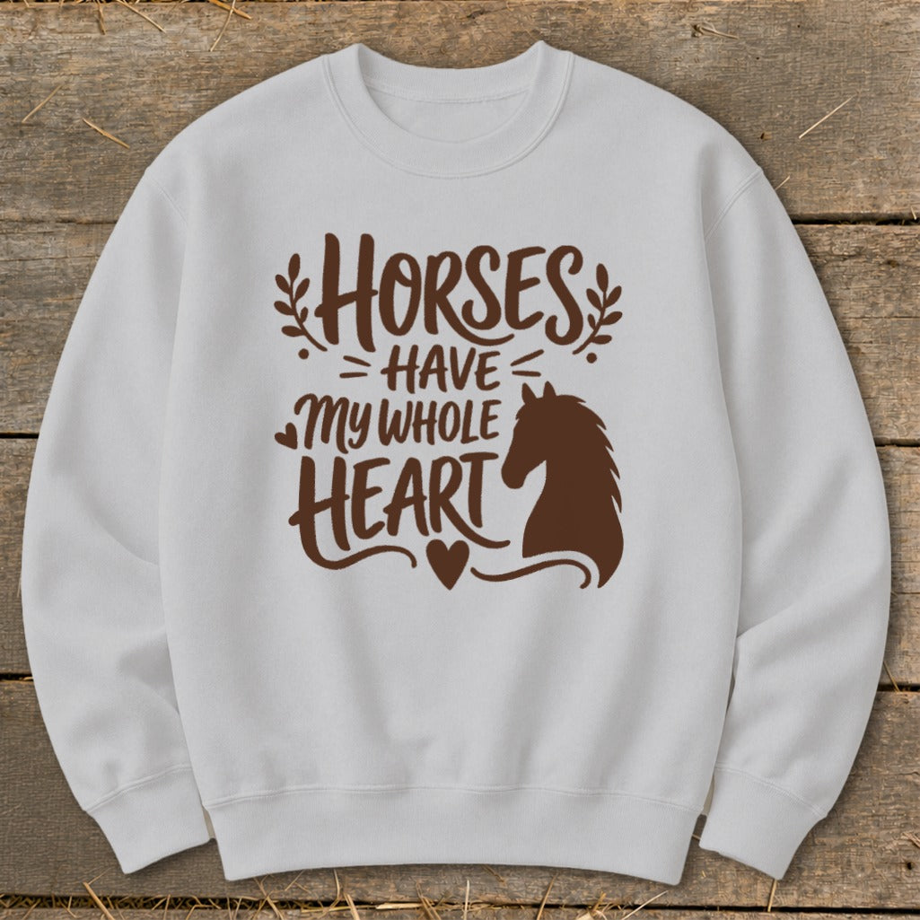 White sweatshirt with brown graphic "Horses Have My Whole Heart" and horse silhouette.