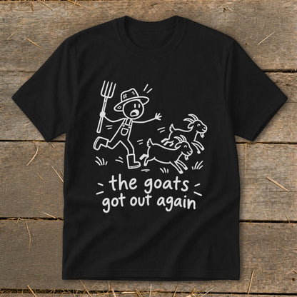 Black t-shirt with white line drawing of a farmer chasing two goats and text "the goats got out again".