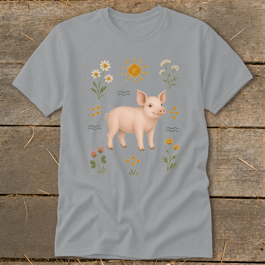 Pink pig surrounded by flowers, sun, and waves on a grey t-shirt.