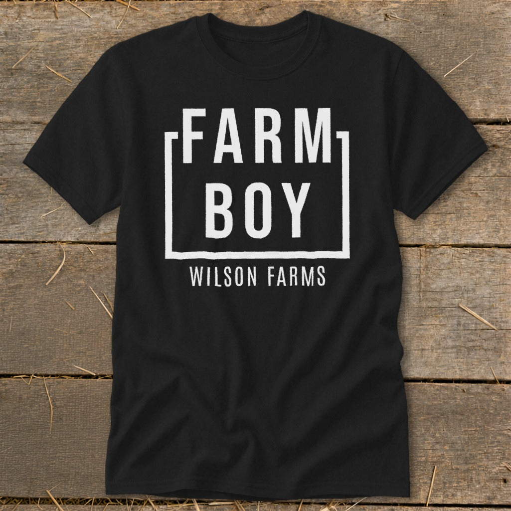 Black t-shirt with "FARM BOY WILSON FARMS" graphic in white text.