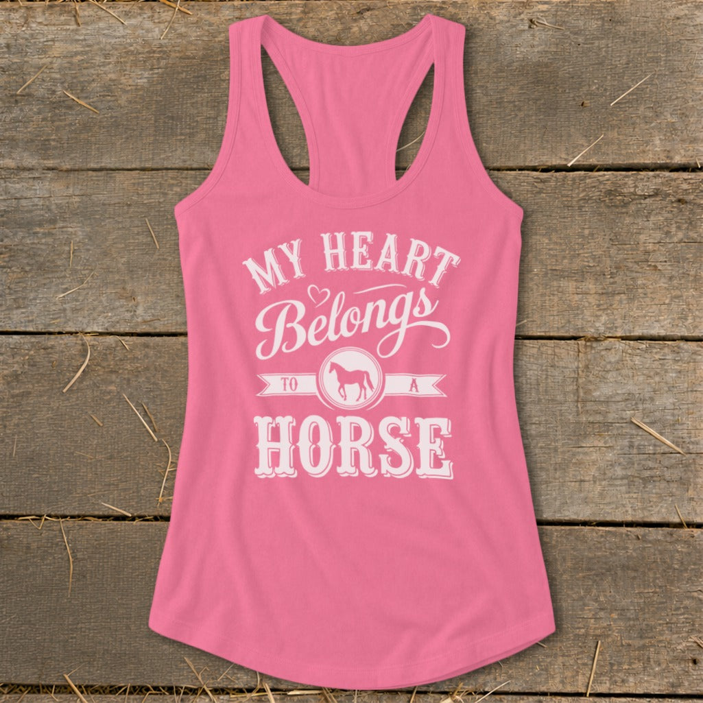 Pink racerback tank top with "My Heart Belongs to a Horse" text and horse graphic.