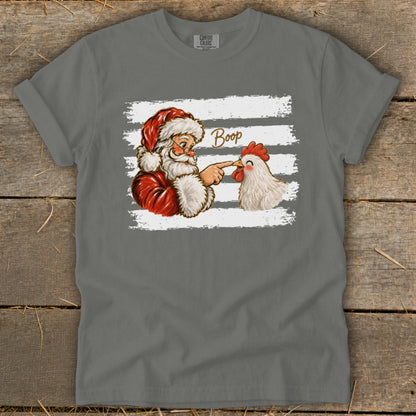 Santa playfully boops a chicken with his finger, the word "Boop" above them.