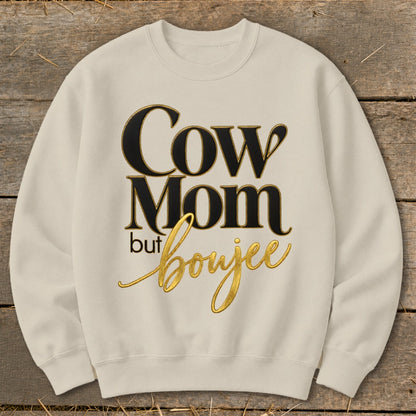 Cream sweatshirt with "Cow Mom but boujee" text in black and gold.