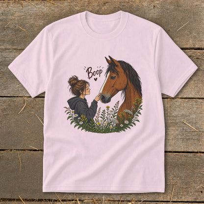 Illustration of a girl gently touching a horse's nose, with the word "Boop" above.