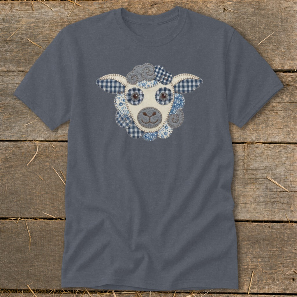 Blue t-shirt with a sheep face appliqué made of various patterned fabrics.