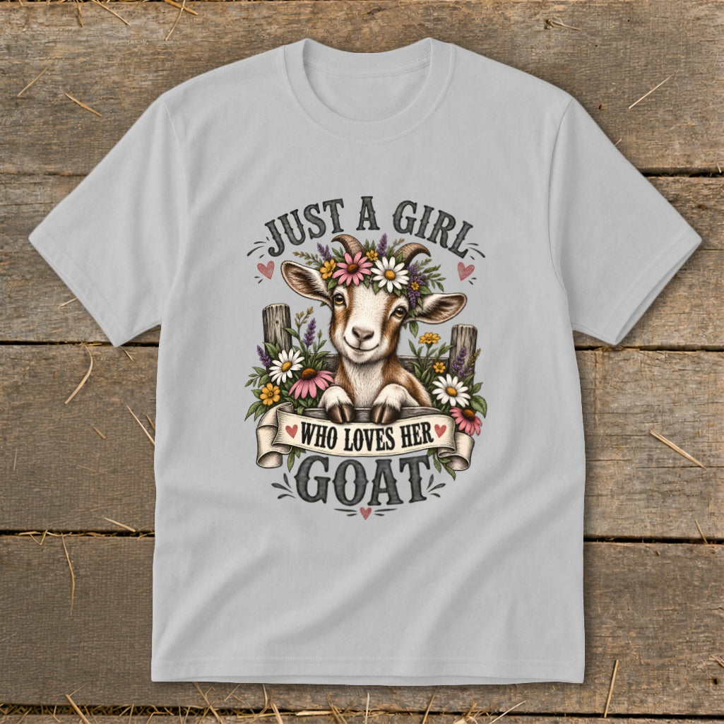 Light gray t-shirt with a drawing of a goat wearing flowers and the text "Just a girl who loves her goat."