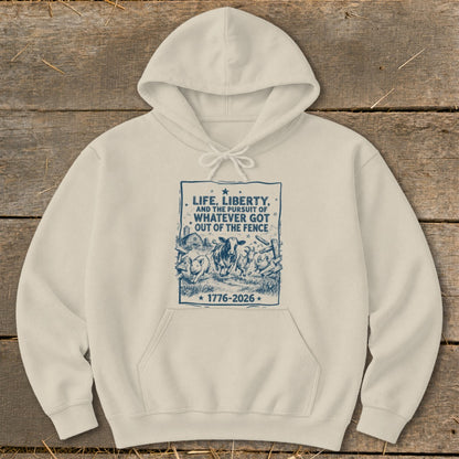 Cream hoodie with blue graphic of farm animals and text "Life, Liberty, and the Pursuit of Whatever Got Out of the Fence".