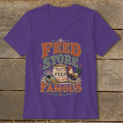 Purple t-shirt with "Feed Store Famous" text, sack of feed, rooster, and scoop.