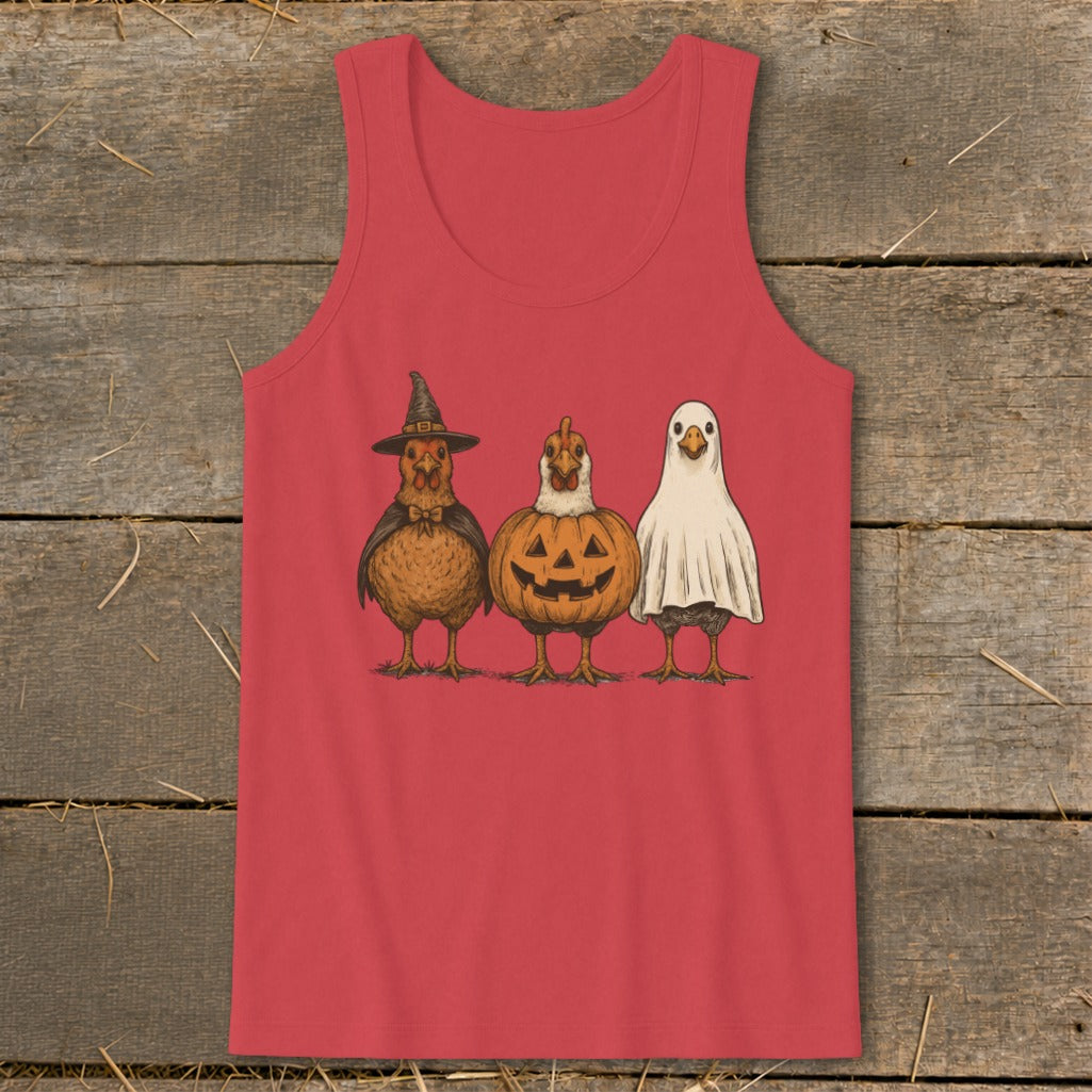 Three chickens dressed for Halloween: witch, pumpkin, and ghost.