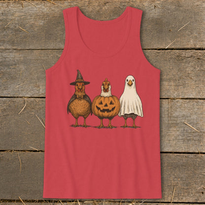 Three chickens dressed for Halloween: witch, pumpkin, and ghost.