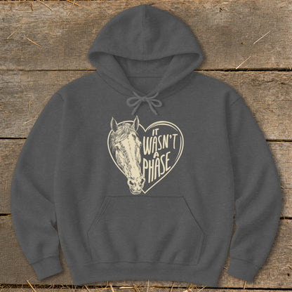 Dark grey hoodie with a horse head inside a heart that reads "It Wasn't A Phase".