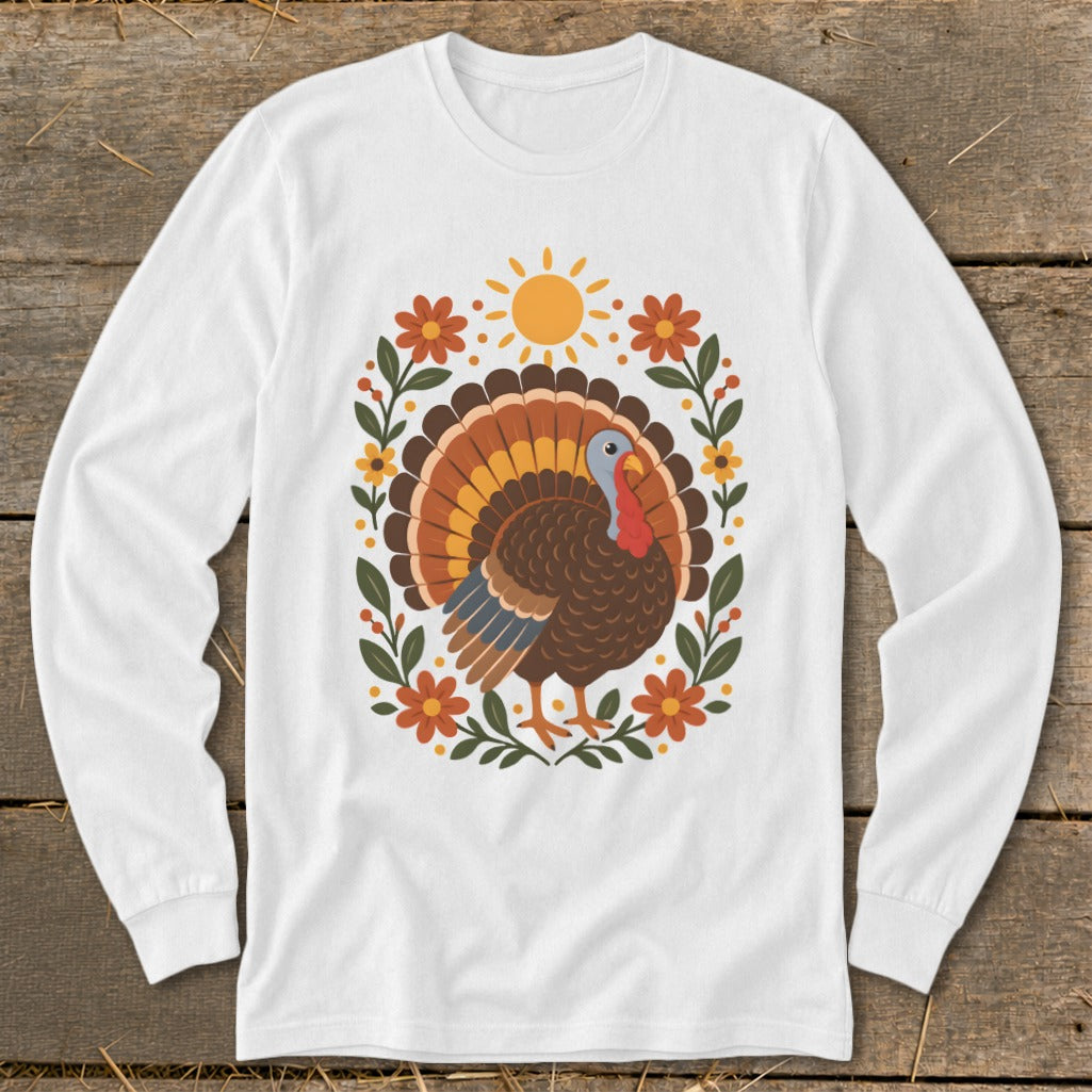 White long-sleeve shirt with a cartoon turkey and floral wreath graphic.