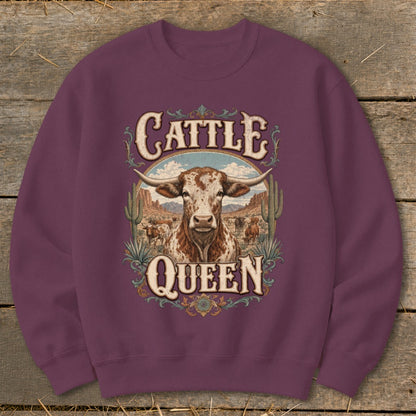 Maroon sweatshirt with "Cattle Queen" graphic featuring a longhorn steer, cacti, and cattle.