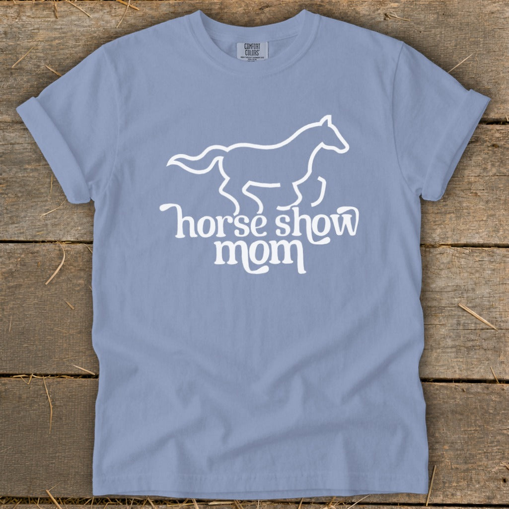 Blue t-shirt with white line art of a horse and text "horse show mom".
