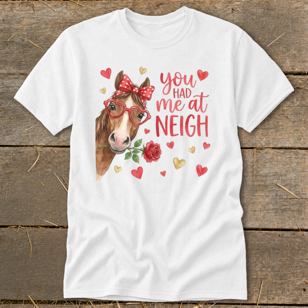Horse with rose in mouth, wearing heart glasses and polka dot bow, text says "you had me at neigh."