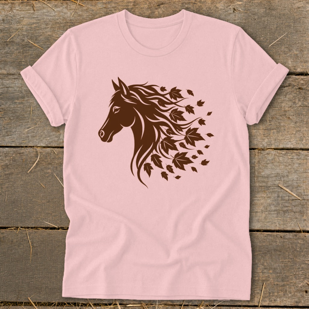 Brown horse head silhouette with flowing mane made of leaves on a pink t-shirt.