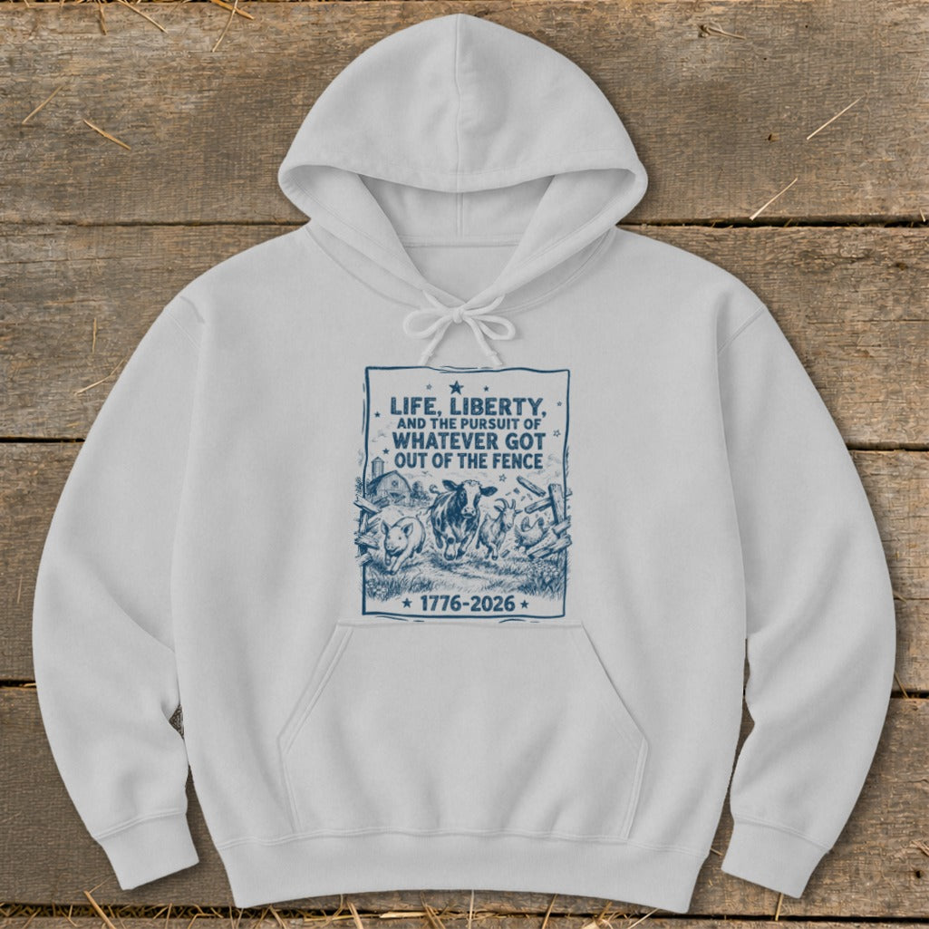 White hoodie with blue graphic featuring farm animals and text "Life, Liberty, and the pursuit of whatever got out of the fence".