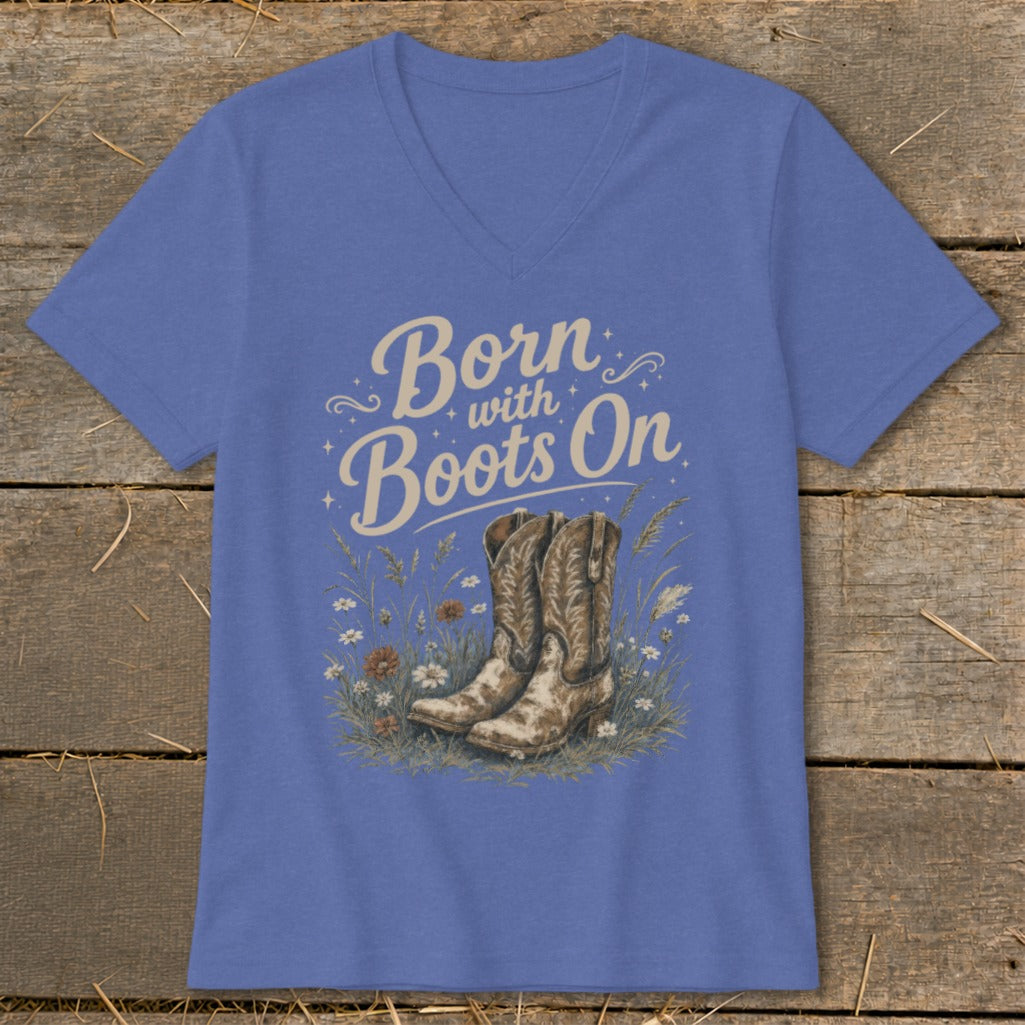Blue v-neck t-shirt with "Born with Boots On" text and cowboy boots graphic.
