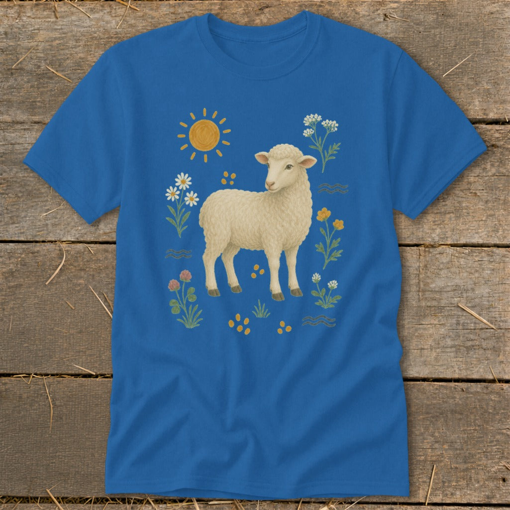 Blue t-shirt with a cream sheep surrounded by flowers, sun, and wavy lines.
