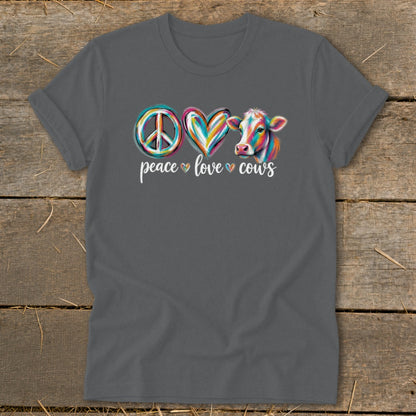 T-shirt with peace, heart, and colorful cow graphics and text "peace love cows".